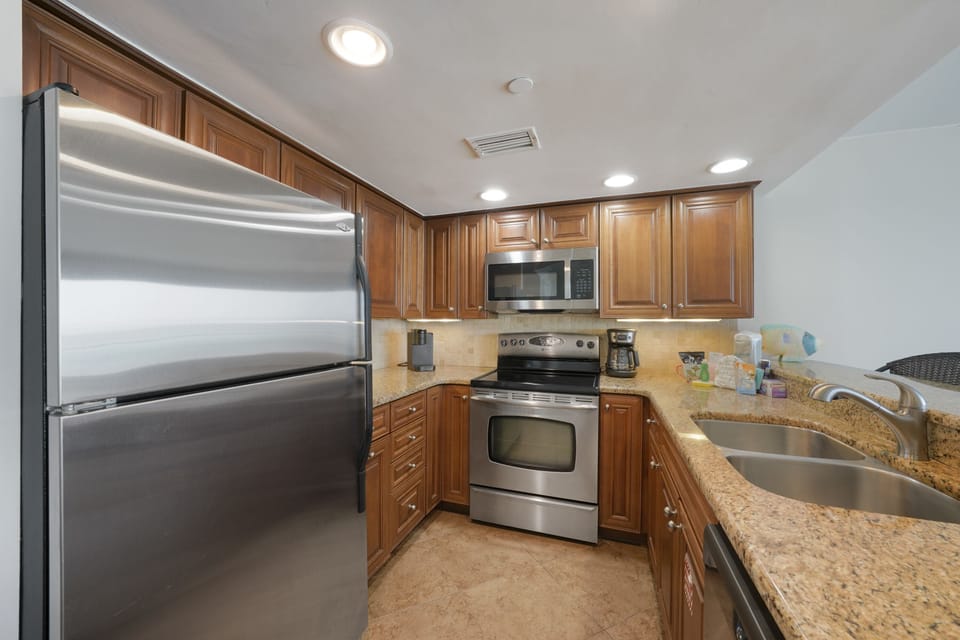 Prepare your favorite dishes with out well equipped kitchen with granite countertops and stainless appliances