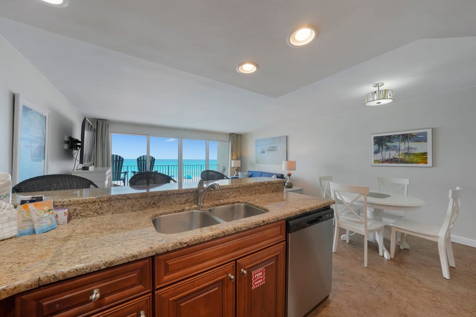 Cabana Club 205 open living space with kitchen, dining, and ocean views