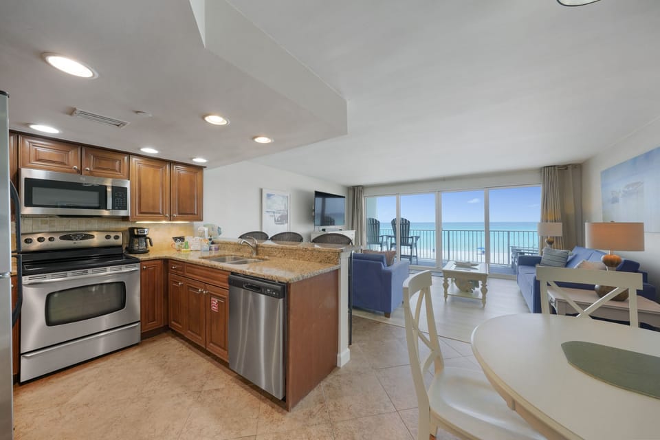 Cabana Club 205 has an open kitchen and living room with breathtaking oceanfront scenery