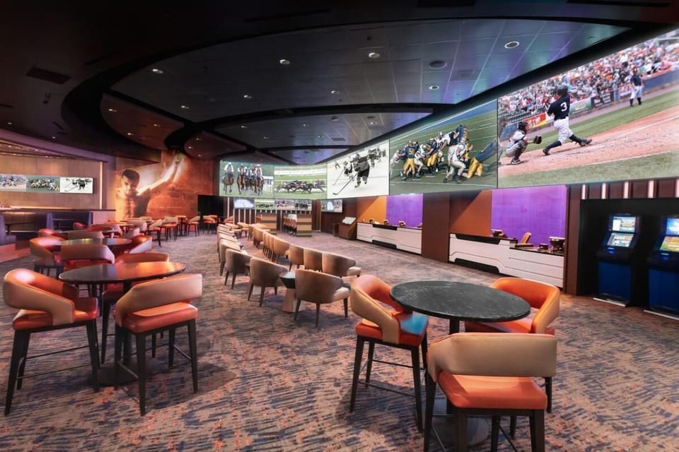 Settle in with cocktails beneath massive game-day screens.