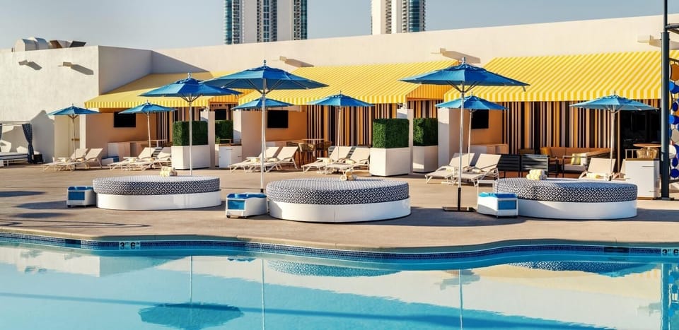 Soak up sunshine with ample loungers and vibrant pool vibes.