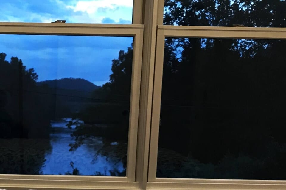 The bedroom has a view of the river