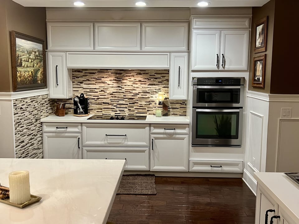 The kitchen appliances include an electric stove, oven/ convection microwave.
