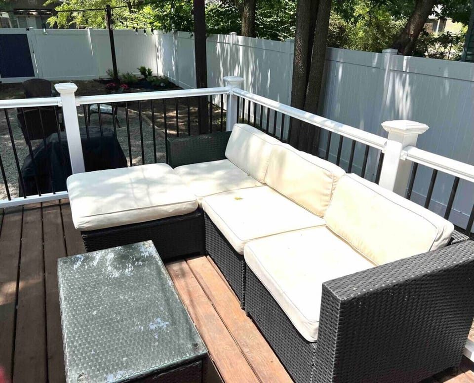 Backyard deck with patio furniture seating