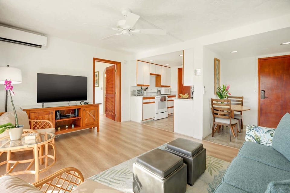 Bright and comfortable living space featuring a cozy sofa sleeper for extra guests and relaxing island evenings.