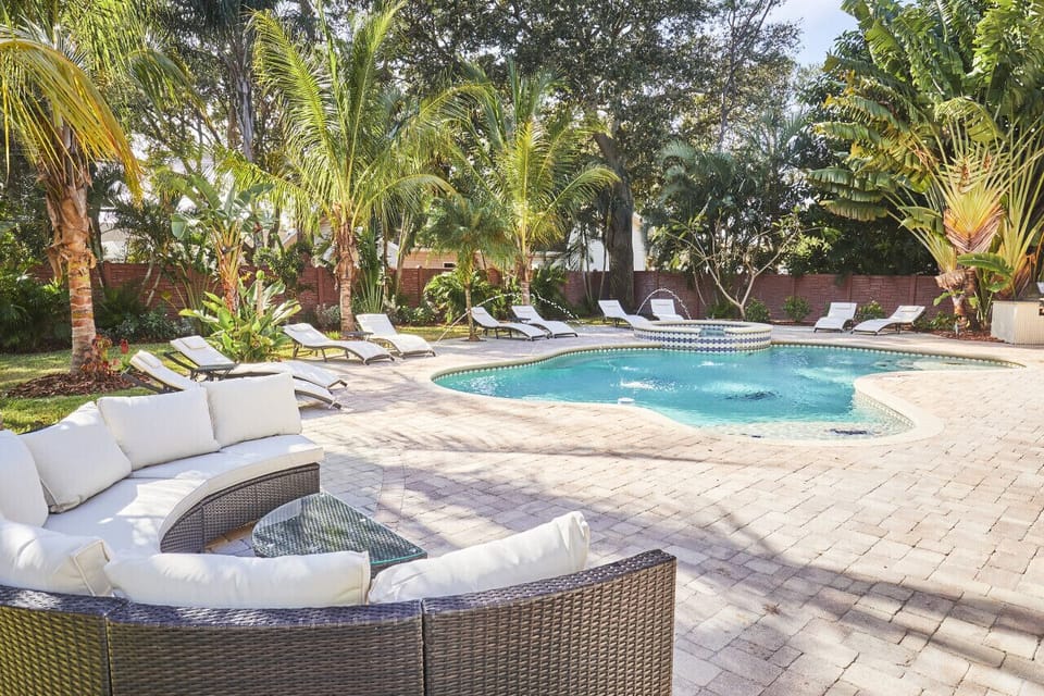 Garden style pool with group seating, lounge chairs for 10 and BBQ area