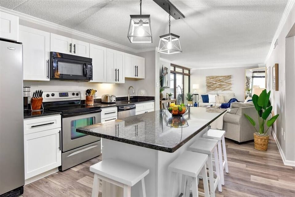 Fully equipped kitchen with modern appliances — perfect for home-cooked meals.
