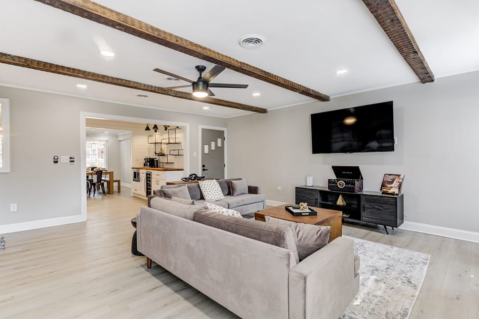 Enjoy our cozy living room, equipped with a large TV & plush seating. The room is perfect for relaxing after a long day or for a cozy night in. Kick back, watch your favorite shows, and make yourself at home.
