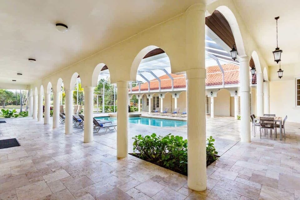 - Unwind and soak up the sun in our inviting shared pool area of the home in Naples, Florida
- Enjoy comfortable lounge chairs for relaxing at the poolside
- Gather with friends or meet fellow guests in this communal space