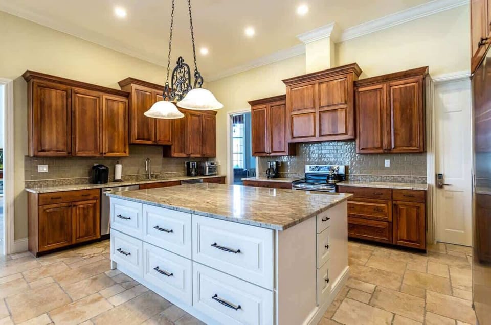 - Enjoy cooking in this spacious and stylish shared kitchen of the home in Naples Florida
- Enjoy clutter-free counters with plenty of storage space in functional kitchen
- Quality materials like granite countertops elevate our kitchen's aesthetic