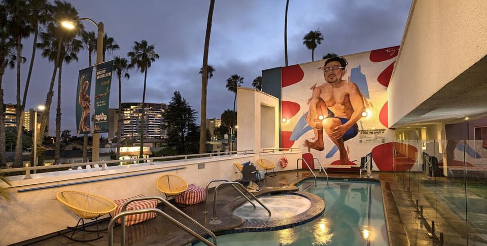 Soak under evening lights by the pool and hot tub.