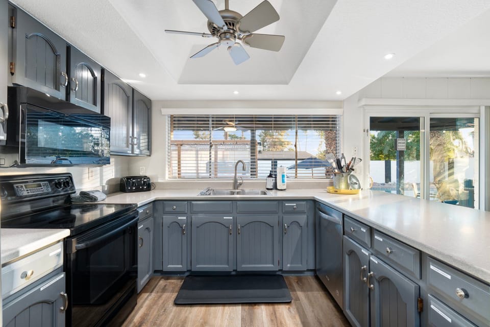 The kitchen is fully stocked with everything you need to cook and clean.