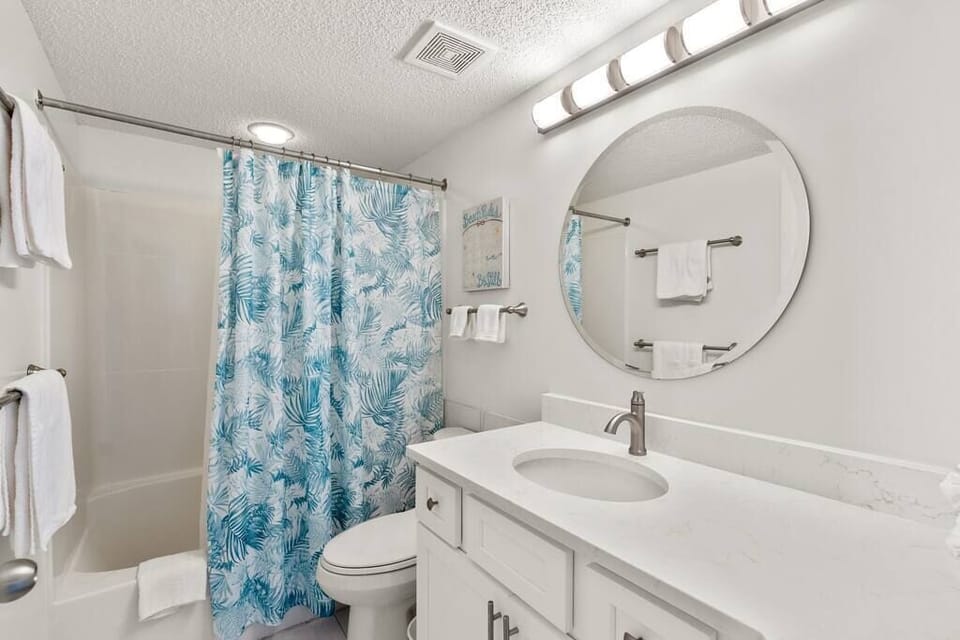 The  newly remodeled master bath is attached to the master bedroom. 