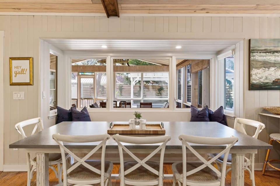 Kitchen overlooks screened porch