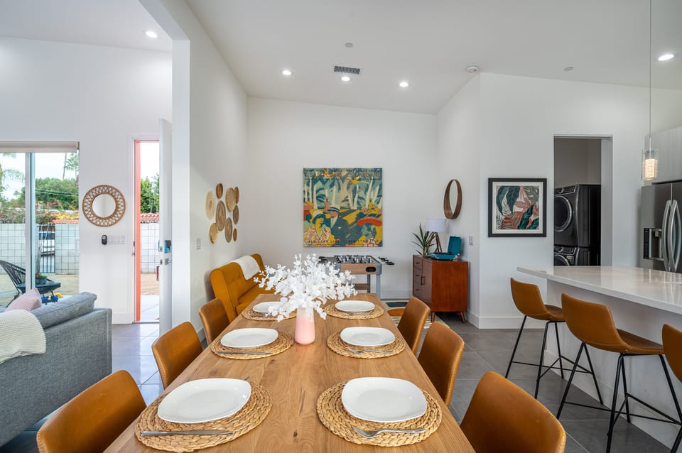 Dining table seats 8. Island bar seats 4.
