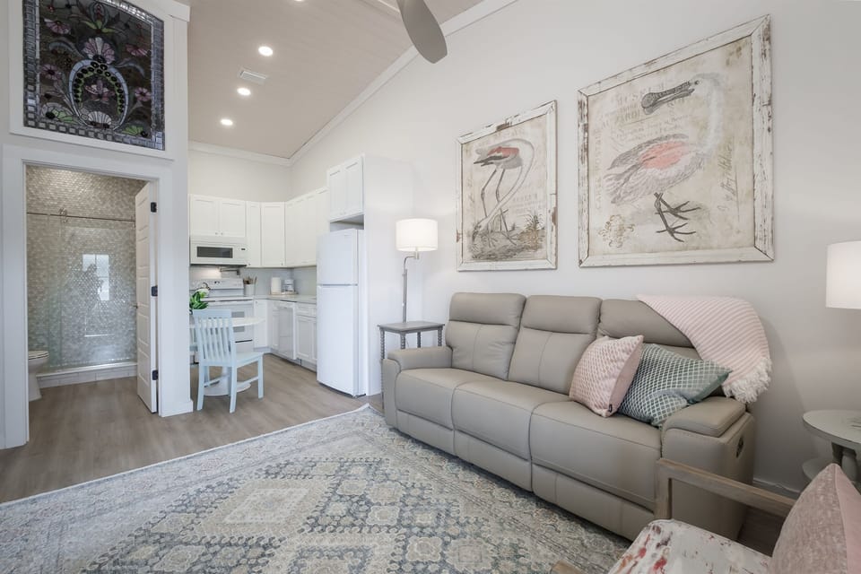 Comfortable Living Space with Italian Leather Couch adjacent to the kitchen 