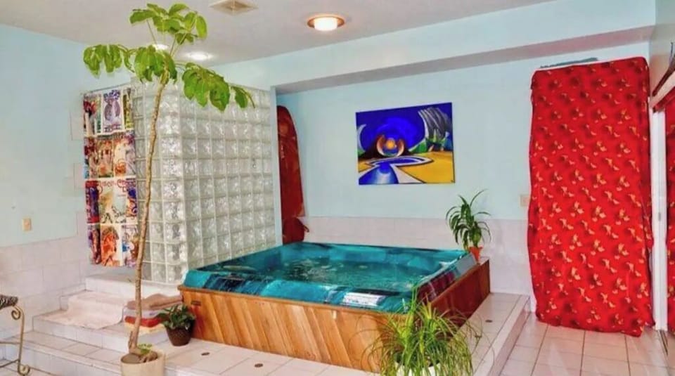 Spa room with hot tub and double shower.