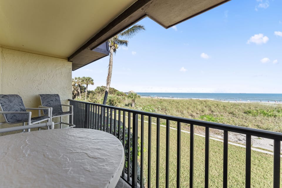Private balcony with peaceful ocean views, perfect for morning coffee.