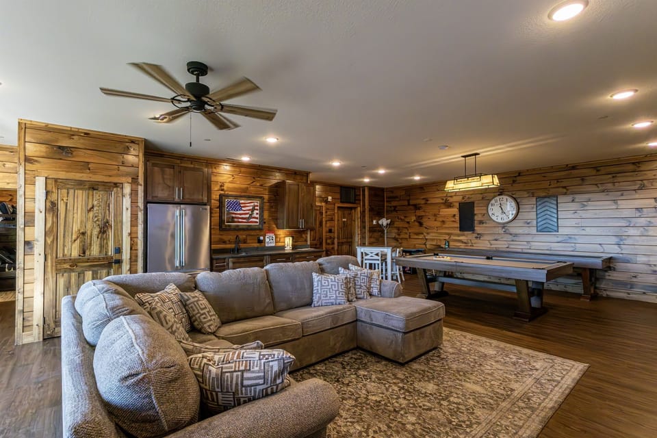 Game room with pool table, two arcade tables, XBOX, shuffleboard, and poker table.  Extra refrigerator also available so you can enjoy without a separate trip to the kitchen!