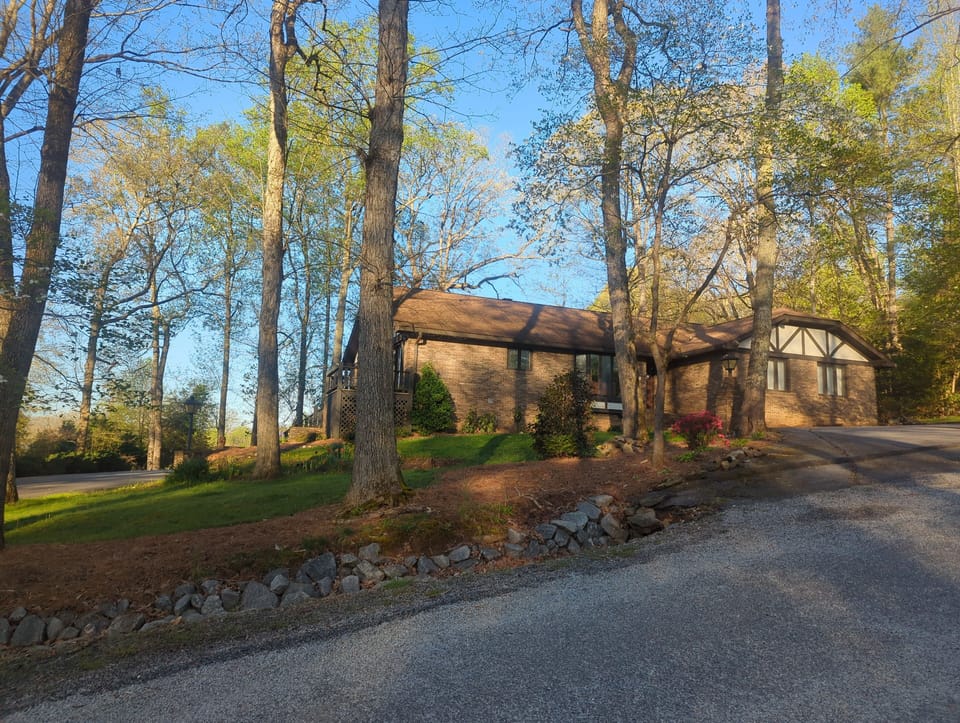 front of house. circular driveway in front. lower driveway for extra parking 