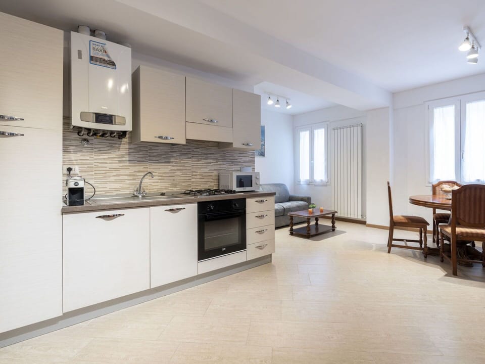 Cabinetry, Furniture, Sink, Countertop, Tap, Kitchen Appliance, Kitchen Stove, Wood, Chair, Window