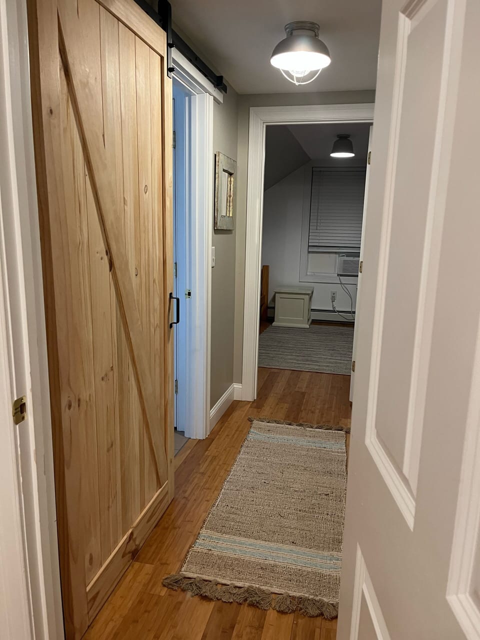 From bedroom on left with queen bed and 2 twin beds 