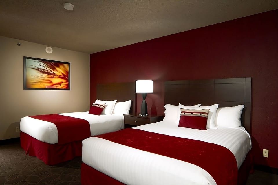 Recharge after a long day in a bright, restful double-queen room.