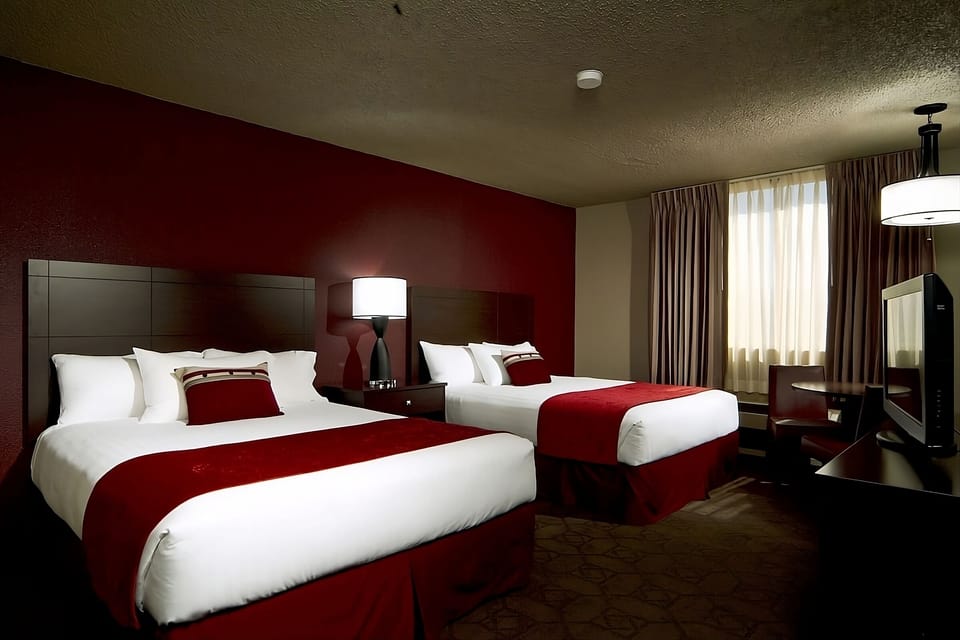 Stretch out and relax with daylight streaming through soft curtains.