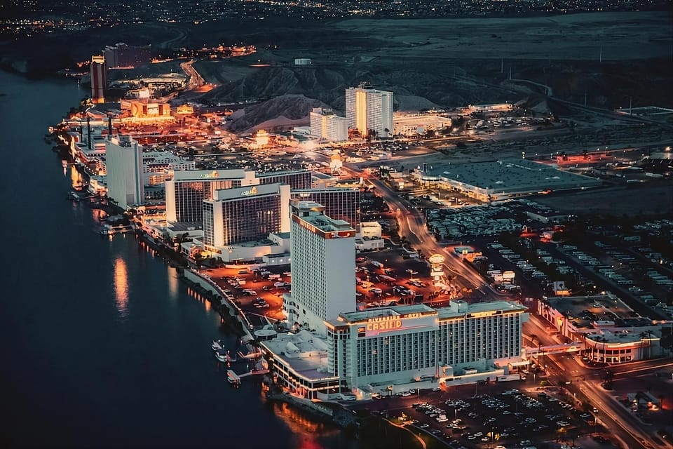 Explore the lively waterfront resorts glowing beautifully after dark.