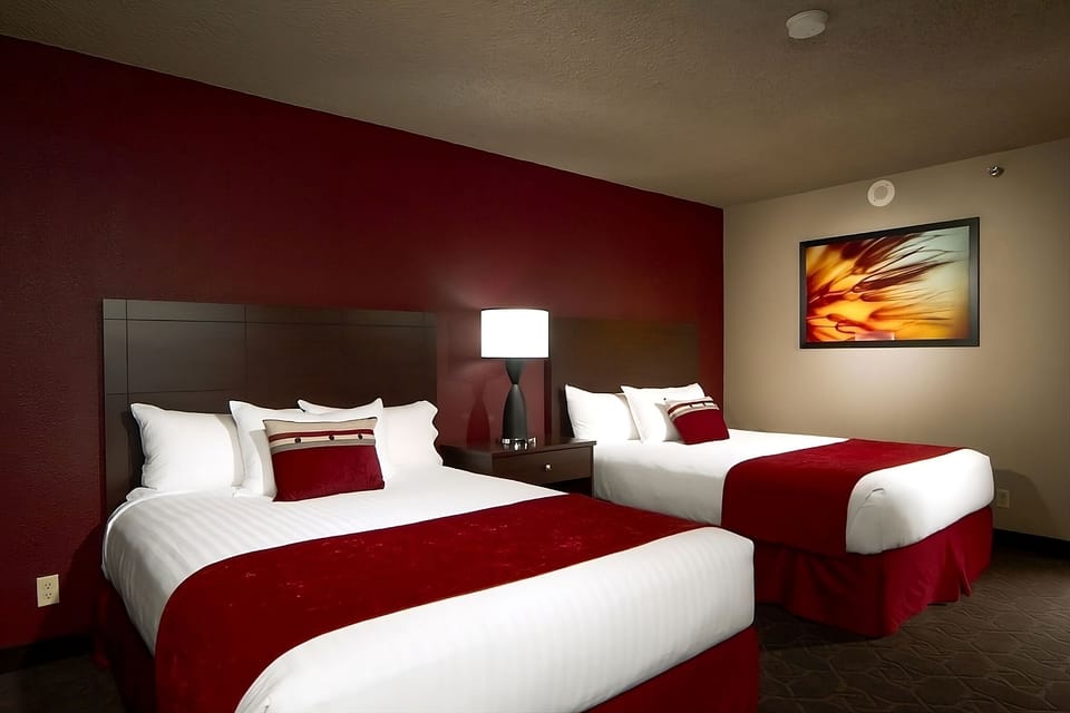 Drift off comfortably in crisp linens and cozy bedside lighting.
