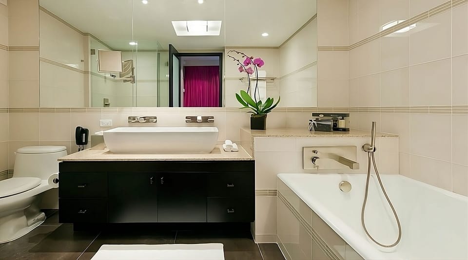 Refresh in a bright bathroom with modern fixtures and tub.