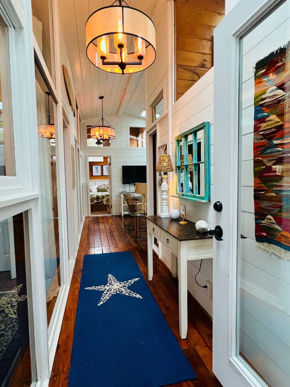 Breezeway hallway to 4 additional bedrooms.