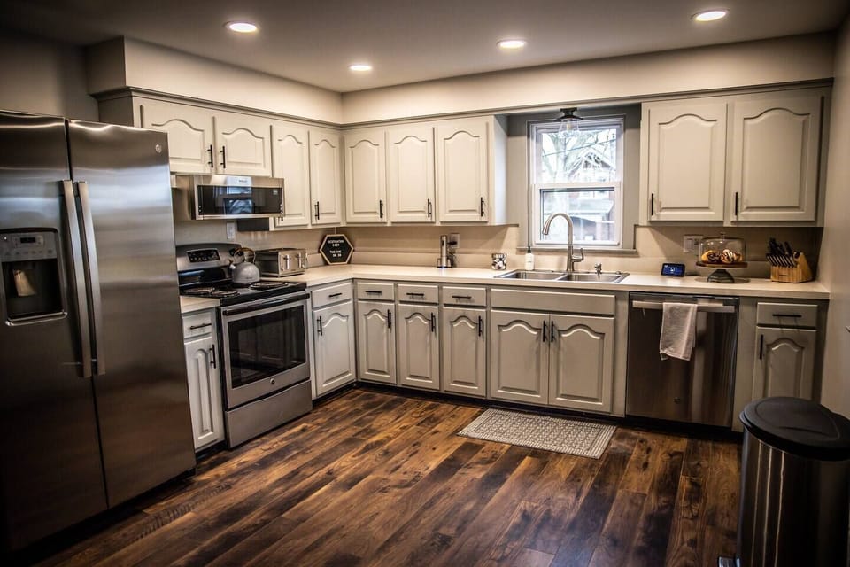 The updated kitchen has plenty of cooking space with new appliances and essential cookware.  The cupboards are stocked with popular spices and olive oil for cooking needs along with dish towels, paper towels, dish soap, hand soap, and dish detergent.