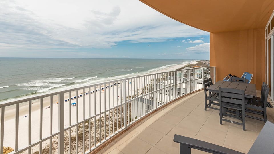 Relax on the balcony and listen to waves along the gulf-front beach as sunlight shimmers on the water
