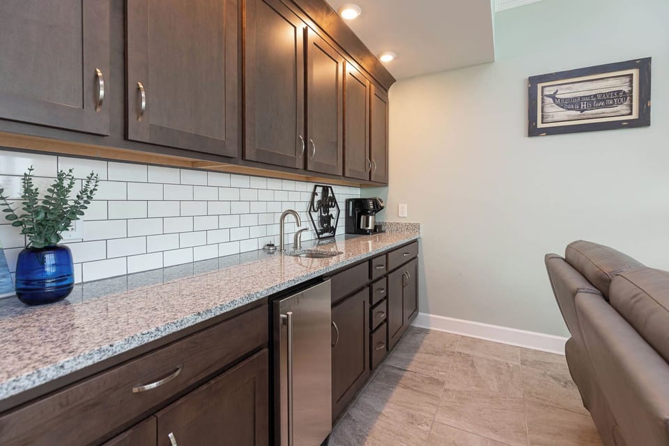 Enjoy brewing fresh coffee at the wet bar or grab a chilled drink from the fridge under the counter