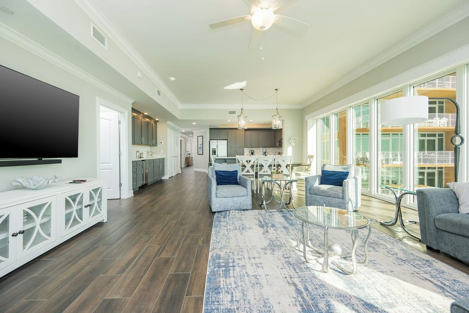 Settle into a comfy armchair, stream shows on the TV, and enjoy sunlight through the panoramic windows