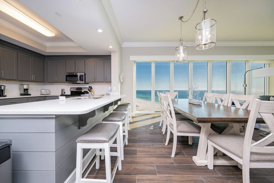 Savor your morning coffee at the breakfast bar with panoramic beach views for the perfect start to your day