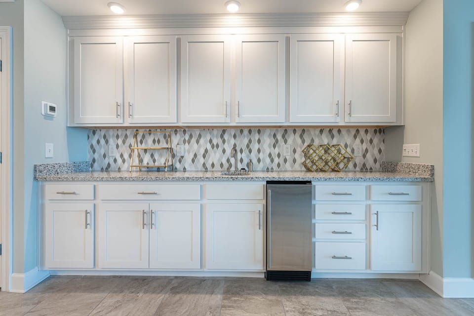 Imagine grabbing a chilled drink from the under-counter fridge at the wet bar and relaxing on the balcony