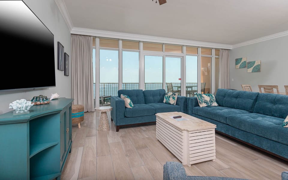 Sink into the plush sofa with a queen sleeper and gaze at the gulf through floor-to-ceiling windows