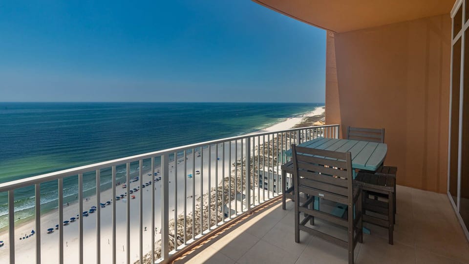 Step onto the balcony to relax at the table and feel the gulf breeze while listening to waves