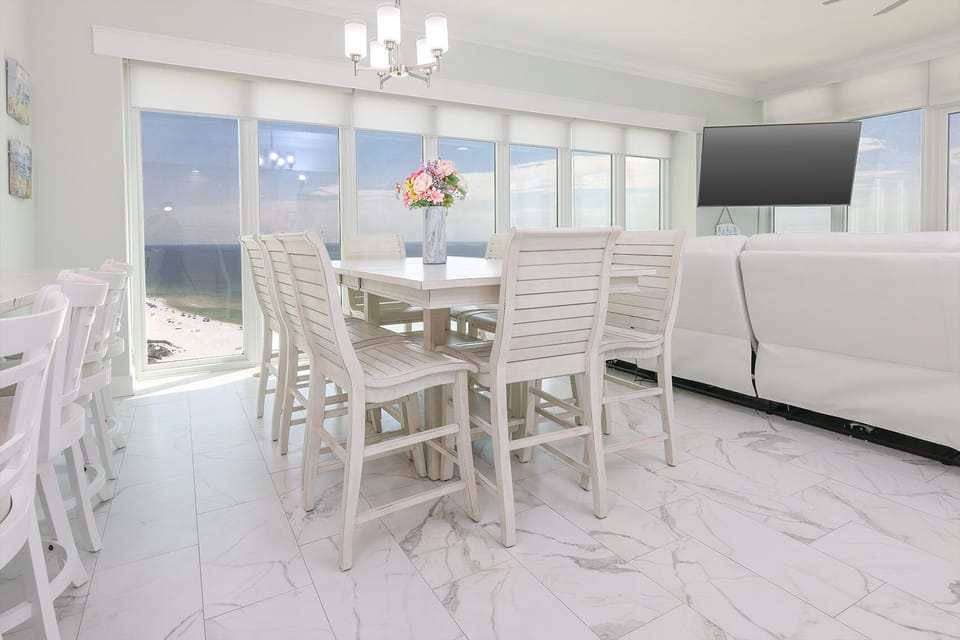 Enjoy a family meal or a fun game night while taking in the panoramic beachfront views
