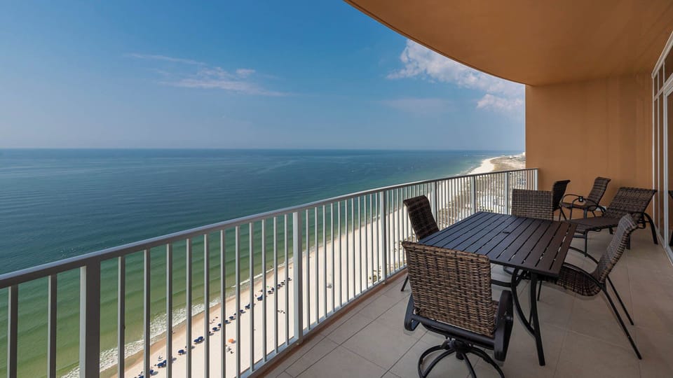 Relax on balcony chairs and feel the gulf breeze while watching the coast stretch along the shoreline