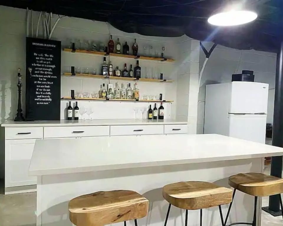 Finished space on ground level w/bar, refrigerator/freezer, and record player.