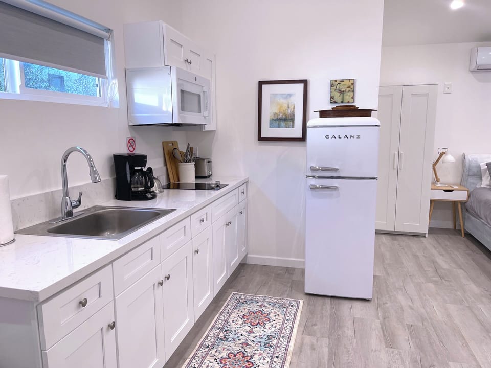 Kitchenette: 2 Burner cooktop, Microwave, Full-size Refrigerator, coffee maker