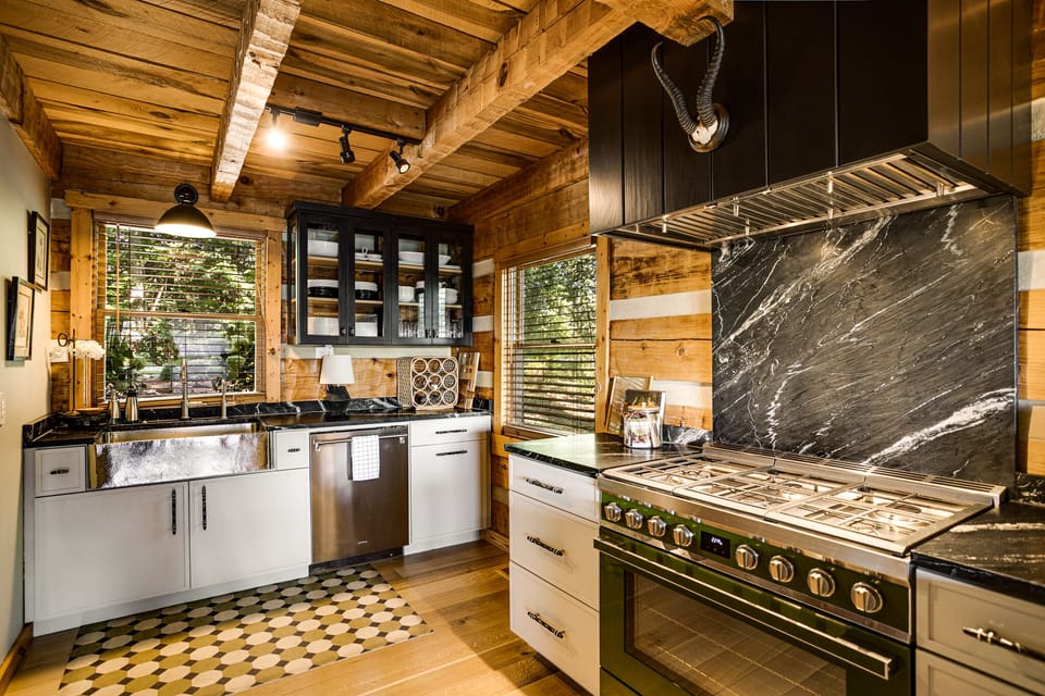 Beautiful soapstone backsplash and countertops w/ a dual fuel SMEG range/oven