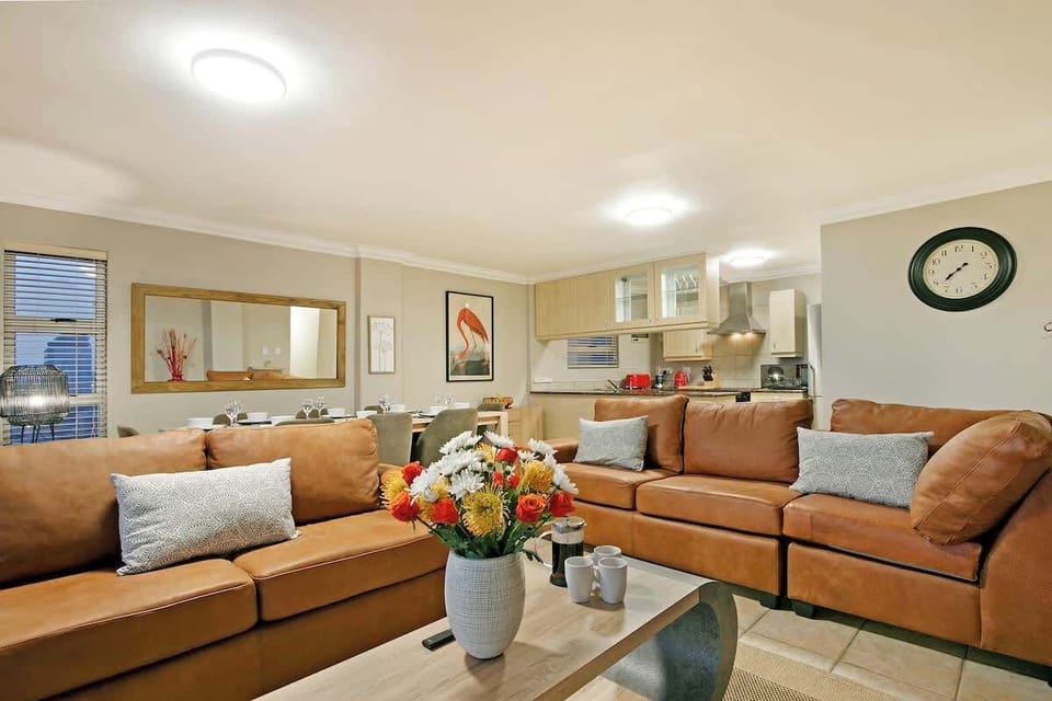 Open plan lounge with an 8 seater dining room table.