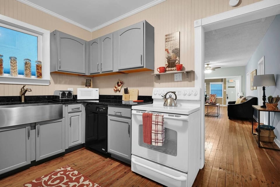 The kitchen connects right into the living room and dining area making the whole house connected. Enough space to cook for the group!