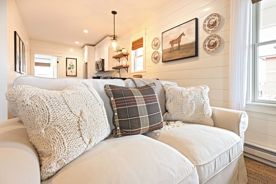 Sink into the sofa and stay a while - this space was made for it.