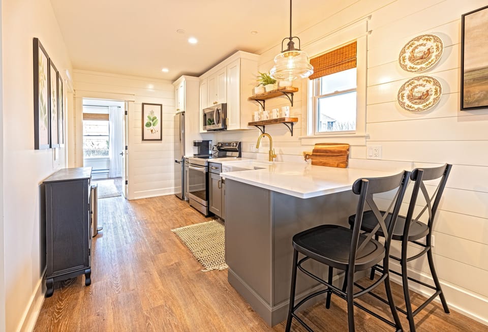 A full kitchen with a charming island — designed for those who love to settle in.
