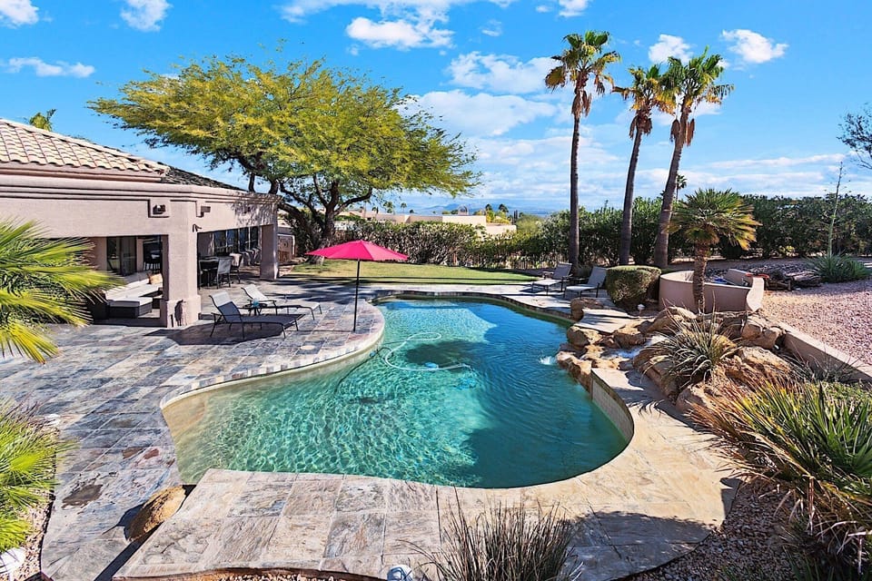 Big backyard with heated pool, sun loungers, outdoor kitchen, playground and mountain views!
